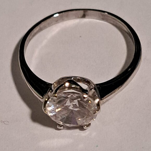 Jewelry - silver chrome color ring with diamond looking stone